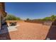 Spacious backyard with patio, shed, and low-maintenance gravel, providing ample outdoor space at 2750 W Pollack St, Phoenix, AZ 85041