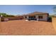 Expansive backyard featuring low-maintenance landscaping and a covered patio area at 2750 W Pollack St, Phoenix, AZ 85041