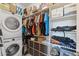 Walk-in closet with laundry machines, shelving, and ample storage space at 2750 W Pollack St, Phoenix, AZ 85041