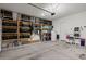 Spacious garage featuring ample storage shelves filled with bins and other items at 2750 W Pollack St, Phoenix, AZ 85041