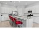 Modern kitchen with white cabinets, granite countertops, and stainless steel appliances at 2750 W Pollack St, Phoenix, AZ 85041