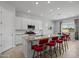 Open kitchen design featuring a large island with bar seating and modern appliances at 2750 W Pollack St, Phoenix, AZ 85041