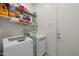 Bright laundry room with machines, shelving and ample storage space at 2750 W Pollack St, Phoenix, AZ 85041