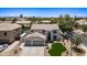 Spacious two-story home with a three-car garage, backyard pool, desert landscaping and well-manicured front yard at 2881 E Estrella Ct, Gilbert, AZ 85296