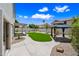 Green backyard featuring artificial turf, xeriscaping, and a charming gazebo at 2881 E Estrella Ct, Gilbert, AZ 85296
