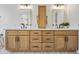 Elegant bathroom showcasing double vanities with modern hardware, quartz countertop, and stylish tile flooring at 2881 E Estrella Ct, Gilbert, AZ 85296