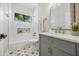 Elegant bathroom with marble counters, modern fixtures, and a garden window at 2881 E Estrella Ct, Gilbert, AZ 85296
