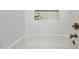 Clean bathtub featuring white tiles and gold fixtures, creating a relaxing space at 2881 E Estrella Ct, Gilbert, AZ 85296