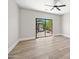 Bright bedroom with hardwood floors, a ceiling fan, and a backyard view at 2881 E Estrella Ct, Gilbert, AZ 85296