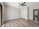 Bedroom features a ceiling fan, sliding-door closet, and natural light at 2881 E Estrella Ct, Gilbert, AZ 85296