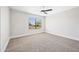 Spacious bedroom featuring a modern ceiling fan, plush carpet, and a bright window at 2881 E Estrella Ct, Gilbert, AZ 85296