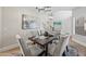 Elegant dining room featuring a wood table, upholstered chairs, and stylish chandelier at 2881 E Estrella Ct, Gilbert, AZ 85296