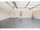 Spacious garage featuring an epoxy floor and ample room for parking and storage at 2881 E Estrella Ct, Gilbert, AZ 85296