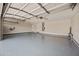 Spacious garage with epoxy flooring, providing a clean and durable surface at 2881 E Estrella Ct, Gilbert, AZ 85296