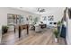 Spacious living room featuring lots of seating, a ceiling fan, light wood floors, and lots of natural light at 2881 E Estrella Ct, Gilbert, AZ 85296