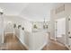 Upstairs loft area with hardwood floors and views into two bedrooms at 2881 E Estrella Ct, Gilbert, AZ 85296