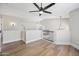A stylish upstairs loft area with neutral walls, hardwood floors, and modern lighting presents an inviting space at 2881 E Estrella Ct, Gilbert, AZ 85296