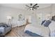 Spacious primary bedroom showcasing hardwood floors, a ceiling fan, and serene, natural light at 2881 E Estrella Ct, Gilbert, AZ 85296