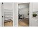 Walk-in pantry and dining room featuring wood floors and chandelier at 2881 E Estrella Ct, Gilbert, AZ 85296