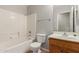 Bathroom featuring tile floors, single sink, and tub with shower at 3050 E Pontiac Dr, Phoenix, AZ 85050