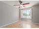 Bedroom showcasing a ceiling fan, hardwood floors, and shuttered windows at 3050 E Pontiac Dr, Phoenix, AZ 85050