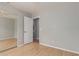 Bedroom showcasing a sliding mirrored closet at 3050 E Pontiac Dr, Phoenix, AZ 85050