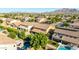 Expansive backyard with a pool, patio, golf area, and lush landscaping, perfect for outdoor activities at 3080 E Andre Ave, Gilbert, AZ 85298