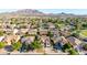 An aerial shot of a neighborhood with beautiful mountain views in the background on a sunny day at 3080 E Andre Ave, Gilbert, AZ 85298
