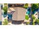 Top-down view of backyard, pool, and tile roof with a parking area in front of the house at 3080 E Andre Ave, Gilbert, AZ 85298