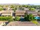 Lush backyard with a covered patio and a sparkling pool, perfect for outdoor entertaining at 3080 E Andre Ave, Gilbert, AZ 85298