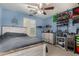 Blue bedroom with white wooden bedframe, dresser, and ceiling fan at 3080 E Andre Ave, Gilbert, AZ 85298