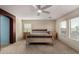 Spacious bedroom featuring a ceiling fan, natural light, and neutral tones at 3080 E Andre Ave, Gilbert, AZ 85298