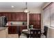 Cozy dining area featuring a round table, wood cabinets, and a window with blinds at 3080 E Andre Ave, Gilbert, AZ 85298