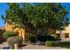 Charming home featuring lush landscaping, manicured bushes, and a shade tree in front yard at 3080 E Andre Ave, Gilbert, AZ 85298