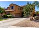 Beautiful home with a large driveway, two car garage and well manicured landscaping and desert rock at 3080 E Andre Ave, Gilbert, AZ 85298