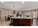 Spacious kitchen with a large breakfast bar that overlooks a comfortable living space with fireplace at 3080 E Andre Ave, Gilbert, AZ 85298