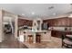 Spacious kitchen with a large center island, breakfast bar, and stainless steel appliances at 3080 E Andre Ave, Gilbert, AZ 85298