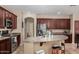 Open kitchen with a center island, stainless steel appliances, and breakfast bar at 3080 E Andre Ave, Gilbert, AZ 85298
