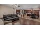 Open floor plan showcasing a spacious living room with hard wood floors and a kitchen in background at 3080 E Andre Ave, Gilbert, AZ 85298