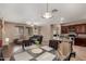Open floor plan showcasing a spacious living room with hard wood floors and a kitchen in background at 3080 E Andre Ave, Gilbert, AZ 85298