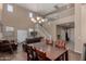 Bright and open living room with a staircase and dining area adjacent to a large open space at 3080 E Andre Ave, Gilbert, AZ 85298