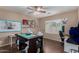 Office features wood flooring, a ceiling fan, a large worktable, and natural lighting from a window at 3080 E Andre Ave, Gilbert, AZ 85298