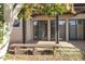 Inviting backyard with a covered patio, desert landscaping, and mature fruit tree at 3345 E University Dr # 2, Mesa, AZ 85213