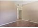 Bedroom features wood-look floors, neutral paint, and a closet with a louvered door at 3345 E University Dr # 2, Mesa, AZ 85213