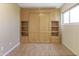 Bedroom shows a built-in Murphy bed with shelving and drawers; the bed is closed at 3345 E University Dr # 2, Mesa, AZ 85213