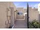 Gated front entrance features well-maintained desert landscaping at 3345 E University Dr # 2, Mesa, AZ 85213