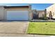 Charming single-level home features a two-car garage, manicured lawn, and gated front entry at 3345 E University Dr # 2, Mesa, AZ 85213