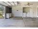 Functional garage space including a laundry area, storage cabinets, and a clean, open layout at 3345 E University Dr # 2, Mesa, AZ 85213