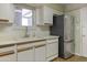 Kitchen features light counter tops, stainless appliances, and hardwood floor at 3345 E University Dr # 2, Mesa, AZ 85213