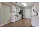 Kitchen with stainless steel fridge, cabinets, and hard surface countertops at 3345 E University Dr # 2, Mesa, AZ 85213